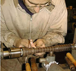 image of bagpipe maker at a lathe